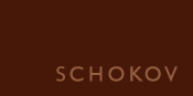 Logo der Firma Schokov: Hellbrauner Schriftzug SCHOKOV auf dunkelbraunem Viereck